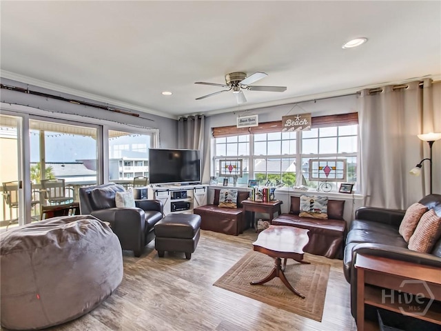 8 Silver Ave Unit 9, Tybee Island, GA 31328 - living room with plenty of natural light, a ceiling fan, wood finished floors, crown molding, and recessed lighting
