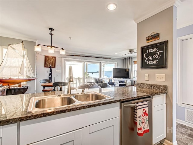 8 Silver Ave Unit 9, Tybee Island, GA 31328 - kitchen with stainless steel dishwasher, ornamental molding, white cabinetry, open floor plan, and a ceiling fan