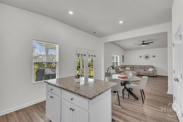 105 Jepson Way, Pooler, GA 31322 - kitchen featuring light wood-style flooring, a center island, white cabinetry, light stone counters, and recessed lighting