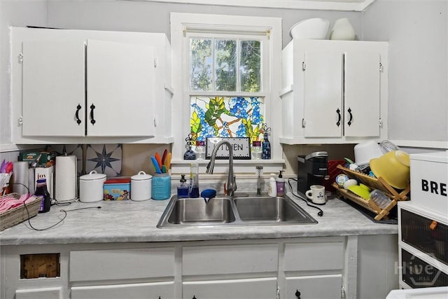 122 W 61st St, Savannah, GA 31405 - kitchen featuring light countertops and white cabinetry