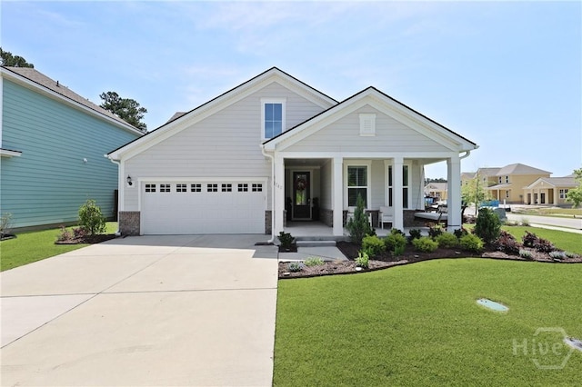 742 Longleaf Dr, Richmond Hill, GA 31324 - view of front of property featuring a porch, driveway, a front lawn, and an attached garage