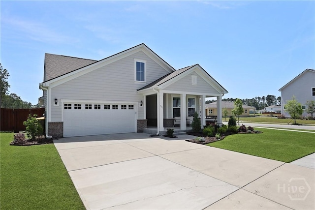 742 Longleaf Dr, Richmond Hill, GA 31324 - view of front facade with covered porch, concrete driveway, brick siding, a garage, and a shingled roof