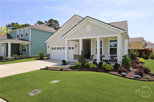 742 Longleaf Dr, Richmond Hill, GA 31324 - view of front of home featuring a porch, concrete driveway, a front lawn, and a garage