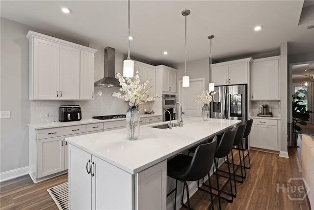 742 Longleaf Dr, Richmond Hill, GA 31324 - kitchen featuring wall chimney exhaust hood, stainless steel appliances, backsplash, dark wood-type flooring, and recessed lighting