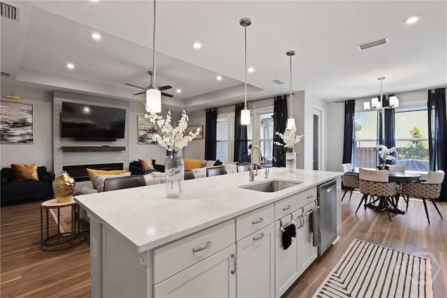 742 Longleaf Dr, Richmond Hill, GA 31324 - kitchen with dishwasher, open floor plan, a chandelier, a kitchen island with sink, and recessed lighting