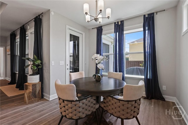 742 Longleaf Dr, Richmond Hill, GA 31324 - dining space with a chandelier and wood finished floors