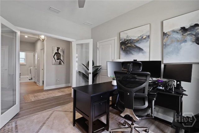 742 Longleaf Dr, Richmond Hill, GA 31324 - home office with wood finished floors and baseboards