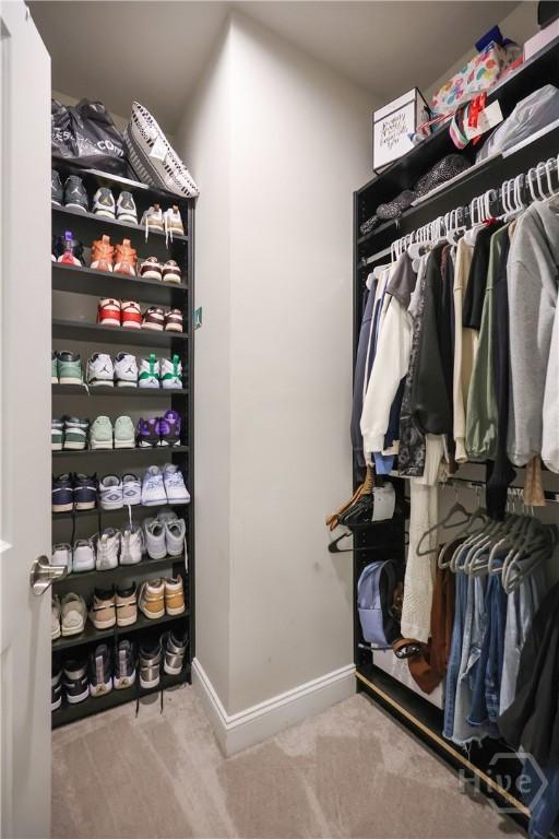 742 Longleaf Dr, Richmond Hill, GA 31324 - walk in closet featuring carpet flooring
