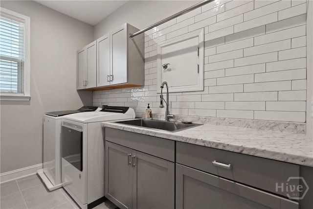 742 Longleaf Dr, Richmond Hill, GA 31324 - laundry room with cabinet space, washing machine and dryer, and light tile patterned floors