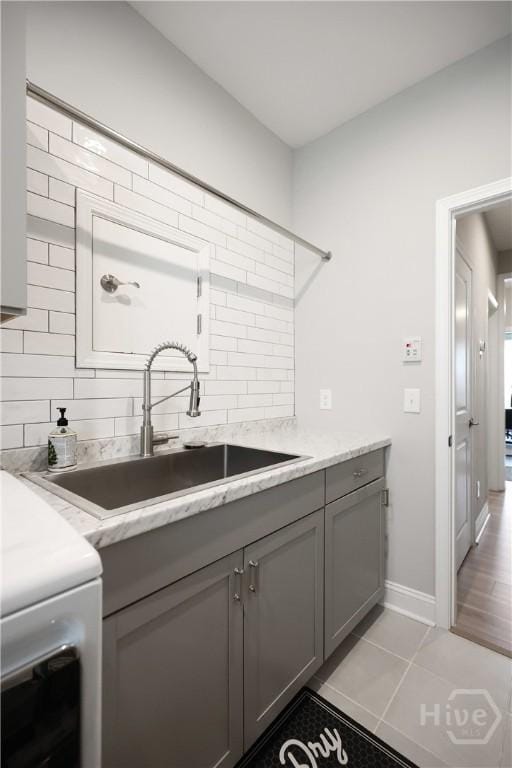 742 Longleaf Dr, Richmond Hill, GA 31324 - washroom with cabinet space, light tile patterned flooring, and washer / clothes dryer