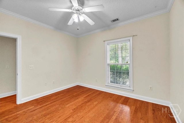 80 Windsong Dr, Richmond Hill, GA 31324 - unfurnished room featuring wood finished floors, ornamental molding, ceiling fan, and a textured ceiling