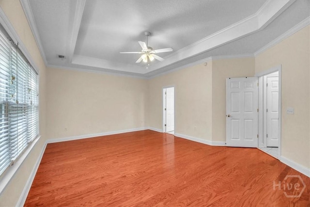 80 Windsong Dr, Richmond Hill, GA 31324 - unfurnished room featuring a raised ceiling, ceiling fan, wood finished floors, and crown molding