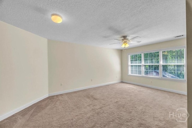 80 Windsong Dr, Richmond Hill, GA 31324 - empty room featuring light carpet, a ceiling fan, and a textured ceiling