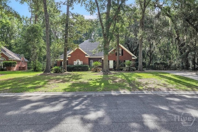 80 Windsong Dr, Richmond Hill, GA 31324 - view of front facade featuring a front yard
