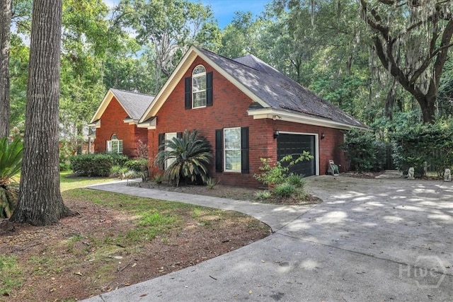 80 Windsong Dr, Richmond Hill, GA 31324 - view of front of property with concrete driveway and brick siding