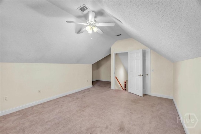 80 Windsong Dr, Richmond Hill, GA 31324 - bonus room featuring light carpet, lofted ceiling, a textured ceiling, and a ceiling fan