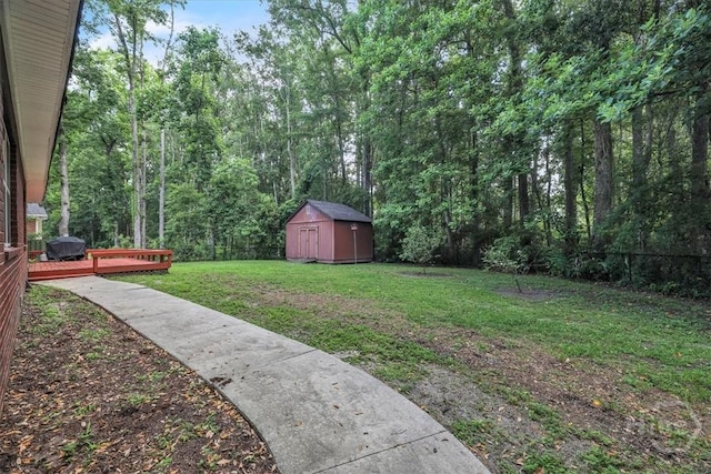 80 Windsong Dr, Richmond Hill, GA 31324 - fenced backyard with a storage unit and a wooden deck