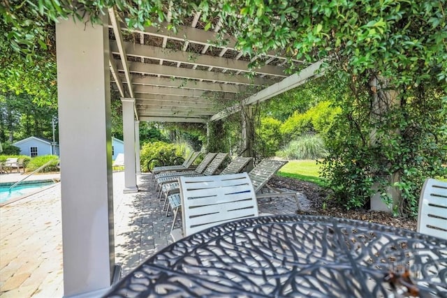 80 Windsong Dr, Richmond Hill, GA 31324 - view of patio / terrace featuring outdoor dining area, a pergola, and an outdoor pool