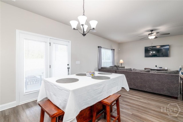 333 Providence Trce, Statesboro, GA 30461 - dining room with wood finished floors, a chandelier, and a ceiling fan