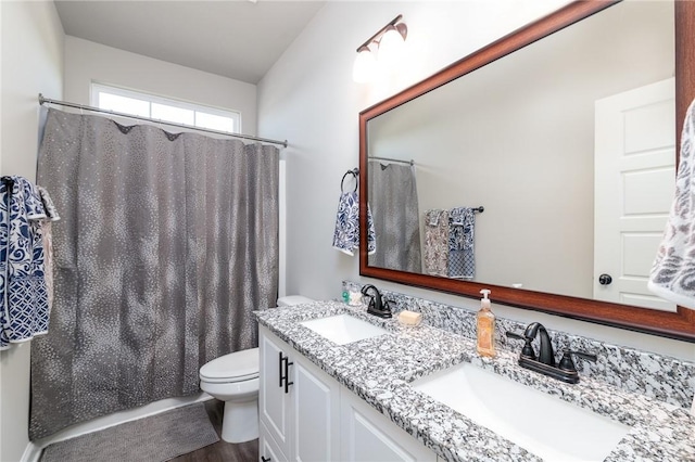 333 Providence Trce, Statesboro, GA 30461 - full bath with double vanity, wood finished floors, and a shower with shower curtain