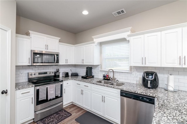 333 Providence Trce, Statesboro, GA 30461 - kitchen featuring stainless steel appliances, white cabinetry, and backsplash
