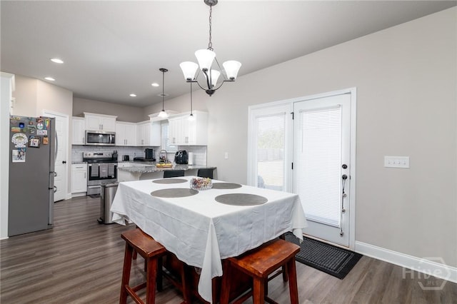 333 Providence Trce, Statesboro, GA 30461 - dining room with a chandelier, dark wood-style floors, and recessed lighting