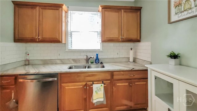 202 Columbus Dr, Savannah, GA 31405 - kitchen with stainless steel dishwasher, decorative backsplash, light countertops, and brown cabinetry