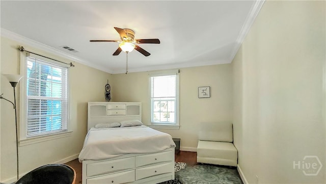 202 Columbus Dr, Savannah, GA 31405 - bedroom with crown molding, multiple windows, a ceiling fan, and dark wood-style floors