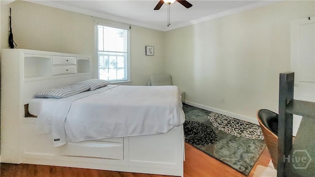 202 Columbus Dr, Savannah, GA 31405 - bedroom with crown molding, a ceiling fan, and wood finished floors