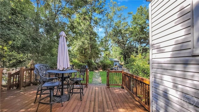 202 Columbus Dr, Savannah, GA 31405 - wooden terrace with outdoor dining space