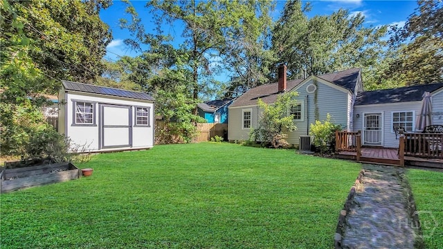 202 Columbus Dr, Savannah, GA 31405 - view of yard with a storage shed and a deck