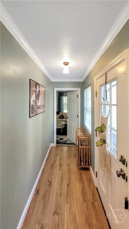 202 Columbus Dr, Savannah, GA 31405 - doorway to outside with light wood finished floors and crown molding