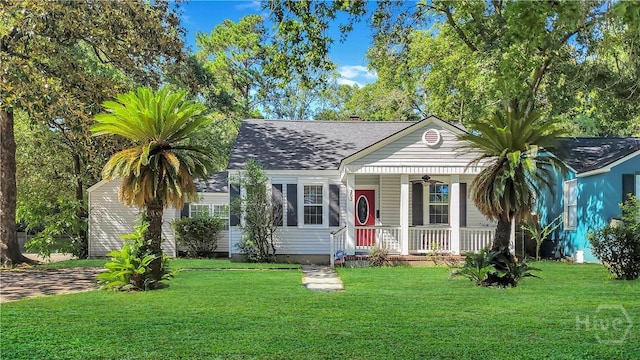 202 Columbus Dr, Savannah, GA 31405 - view of front of property with a porch, ceiling fan, a front yard, and a shingled roof