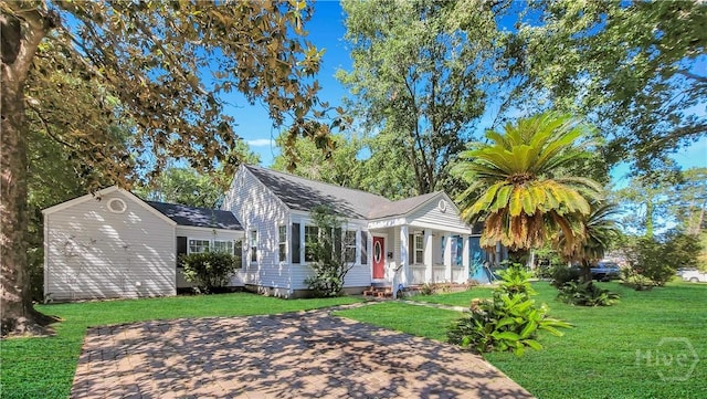 202 Columbus Dr, Savannah, GA 31405 - view of front of property with a front yard and a porch