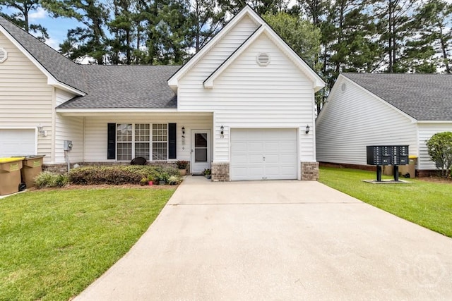 12 Crossing Dr, Richmond Hill, GA 31324 - view of front of house with a front yard, a shingled roof, and driveway