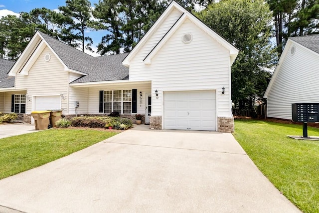 12 Crossing Dr, Richmond Hill, GA 31324 - view of front facade with a shingled roof, stone siding, a front lawn, and concrete driveway