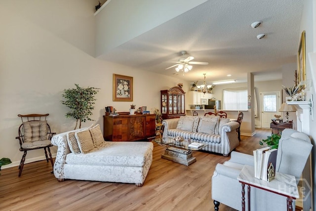 12 Crossing Dr, Richmond Hill, GA 31324 - living area with ceiling fan, light wood-style flooring, and a chandelier