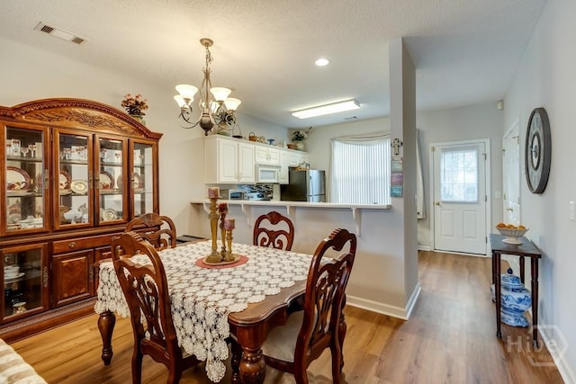 12 Crossing Dr, Richmond Hill, GA 31324 - dining space featuring a chandelier, light wood finished floors, and recessed lighting