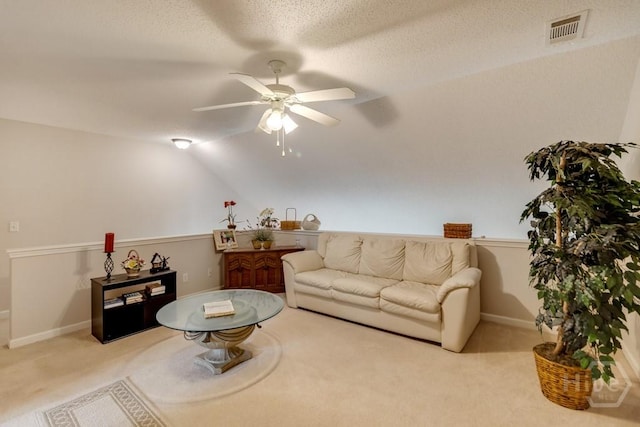 12 Crossing Dr, Richmond Hill, GA 31324 - living room featuring carpet, ceiling fan, vaulted ceiling, and a textured ceiling