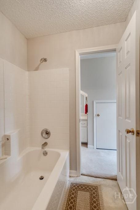 12 Crossing Dr, Richmond Hill, GA 31324 - bathroom with a textured ceiling and tub / shower combination