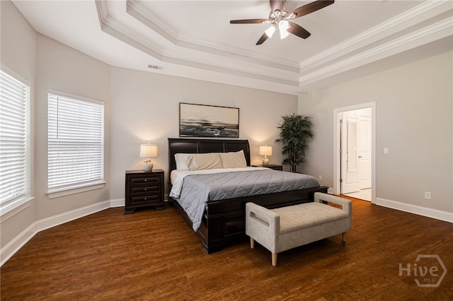 28 Misty Marsh Dr, Savannah, GA 31419 - bedroom featuring a tray ceiling, dark wood-type flooring, crown molding, and a ceiling fan
