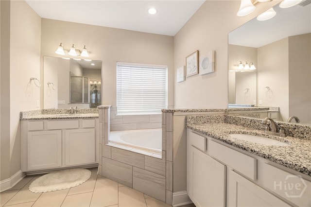 28 Misty Marsh Dr, Savannah, GA 31419 - full bathroom with a stall shower, tile patterned floors, two vanities, a garden tub, and recessed lighting