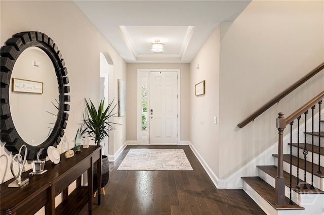 28 Misty Marsh Dr, Savannah, GA 31419 - entrance foyer featuring a tray ceiling, dark wood finished floors, stairway, and arched walkways