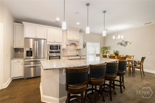 28 Misty Marsh Dr, Savannah, GA 31419 - kitchen featuring appliances with stainless steel finishes, dark wood-style floors, tasteful backsplash, and recessed lighting