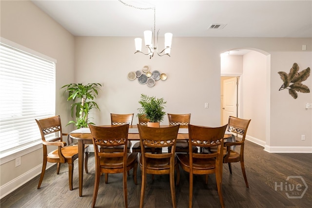 28 Misty Marsh Dr, Savannah, GA 31419 - dining space featuring healthy amount of natural light, arched walkways, dark wood-type flooring, and a chandelier