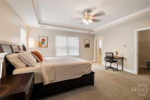 28 Misty Marsh Dr, Savannah, GA 31419 - bedroom featuring a raised ceiling, light colored carpet, crown molding, a ceiling fan, and a walk in closet