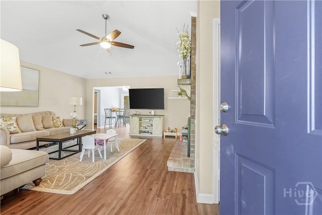 139 Crossover Ln, Savannah, GA 31410 - living room featuring ceiling fan, wood finished floors, and vaulted ceiling