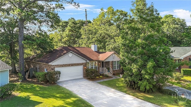 139 Crossover Ln, Savannah, GA 31410 - single story home with brick siding, an attached garage, a front yard, driveway, and a chimney