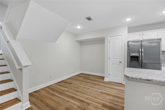 13 Abaco Ct, Savannah, GA 31419 - below grade area featuring stainless steel fridge with ice dispenser, stairs, light wood-style flooring, and recessed lighting