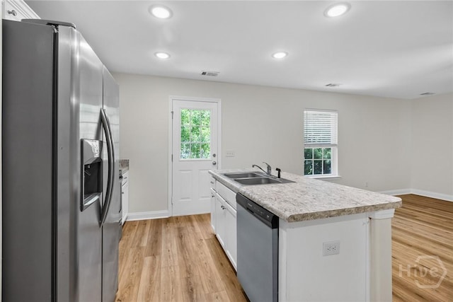 13 Abaco Ct, Savannah, GA 31419 - kitchen with appliances with stainless steel finishes, plenty of natural light, light wood-type flooring, white cabinetry, and recessed lighting